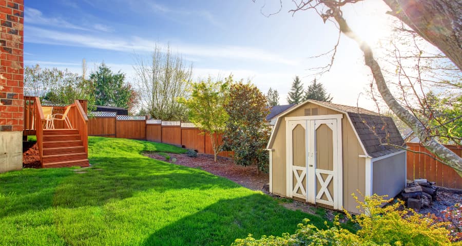 Fenced backyard with storage shed in Los Angeles